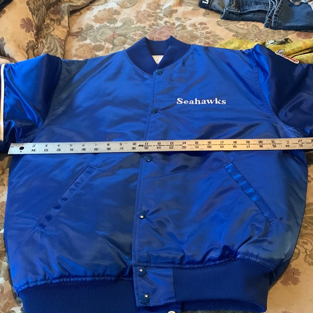 Never worn NFL Seahawks jacket. Satin size Large. Comes from a Smoke free home.
